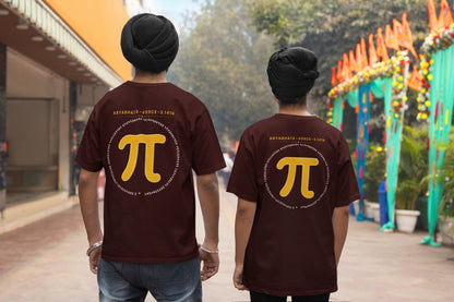 Maroon Aryabhata Pi oversized t-shirt, back view worn by two men on a festive street showing the mustard pi back print