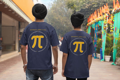 Navy Blue Aryabhata Pi oversized t-shirt, back view worn by two men on a festive street showing the mustard pi back print