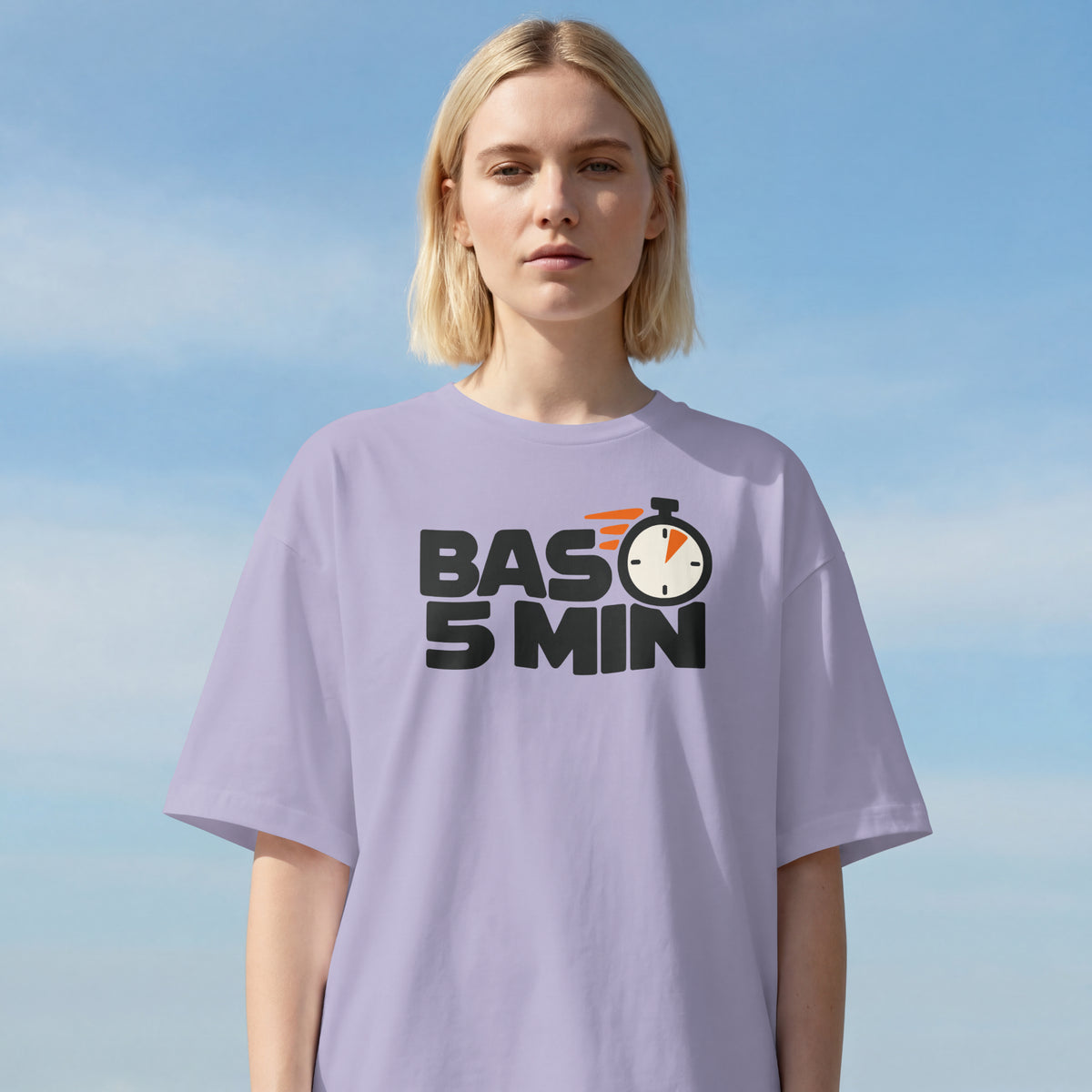 Lavender Bas 5 Min unisex oversized t-shirt worn by a woman outdoors, stopwatch slogan print on the chest