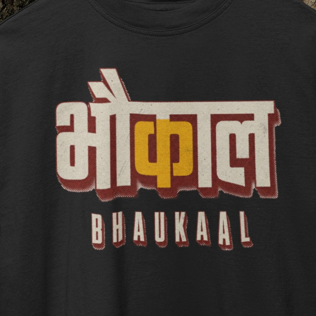 Black Bhaukaal oversized t-shirt, close-up of the cream and mustard 3D Hindi typography print