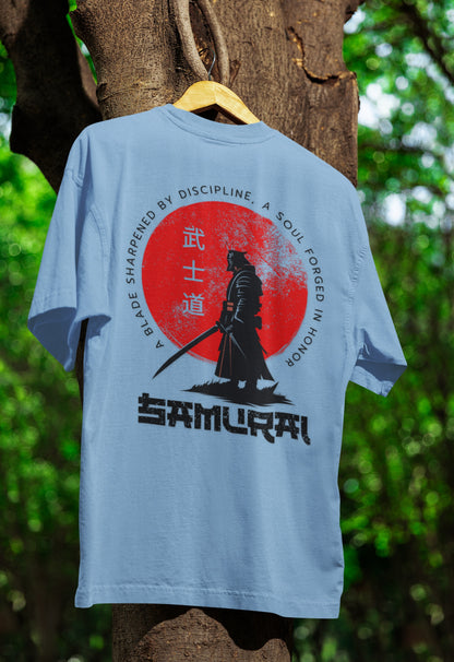 Flat lay of Nauma Bushido Discipline baby blue oversized T-shirt with samurai graphic
