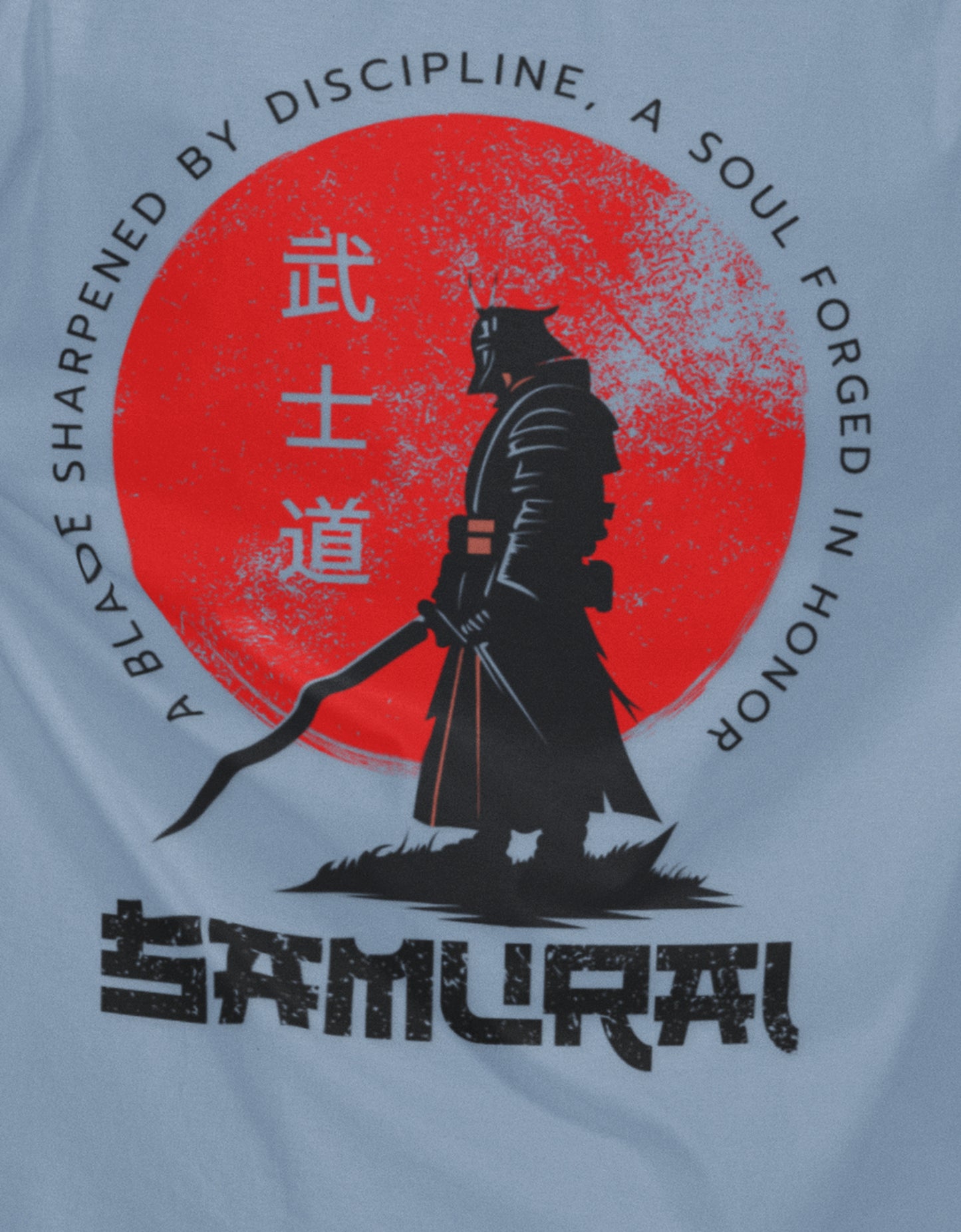 Close-up of samurai silhouette and red sun print on Nauma baby blue oversized T-shirt