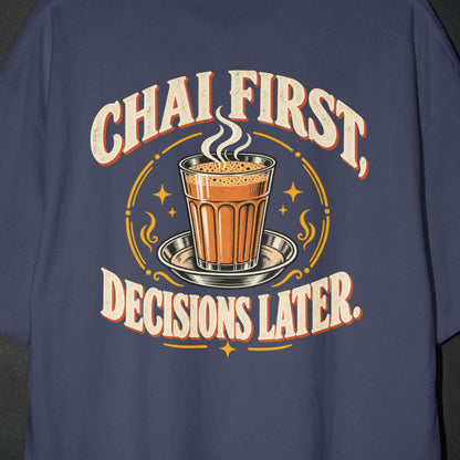 Navy Blue Chai First Decisions Later T-shirt print close-up: cream retro lettering around a steaming cutting chai glass on a steel saucer
