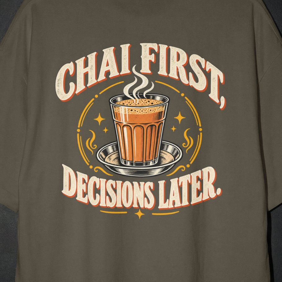 Olive Green Chai First Decisions Later T-shirt print close-up: cream retro lettering around a steaming cutting chai glass on a steel saucer