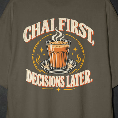 Olive Green Chai First Decisions Later T-shirt print close-up: cream retro lettering around a steaming cutting chai glass on a steel saucer