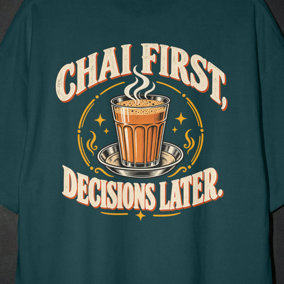 Petrol Blue Chai First Decisions Later T-shirt print close-up: cream retro lettering around a steaming cutting chai glass on a steel saucer