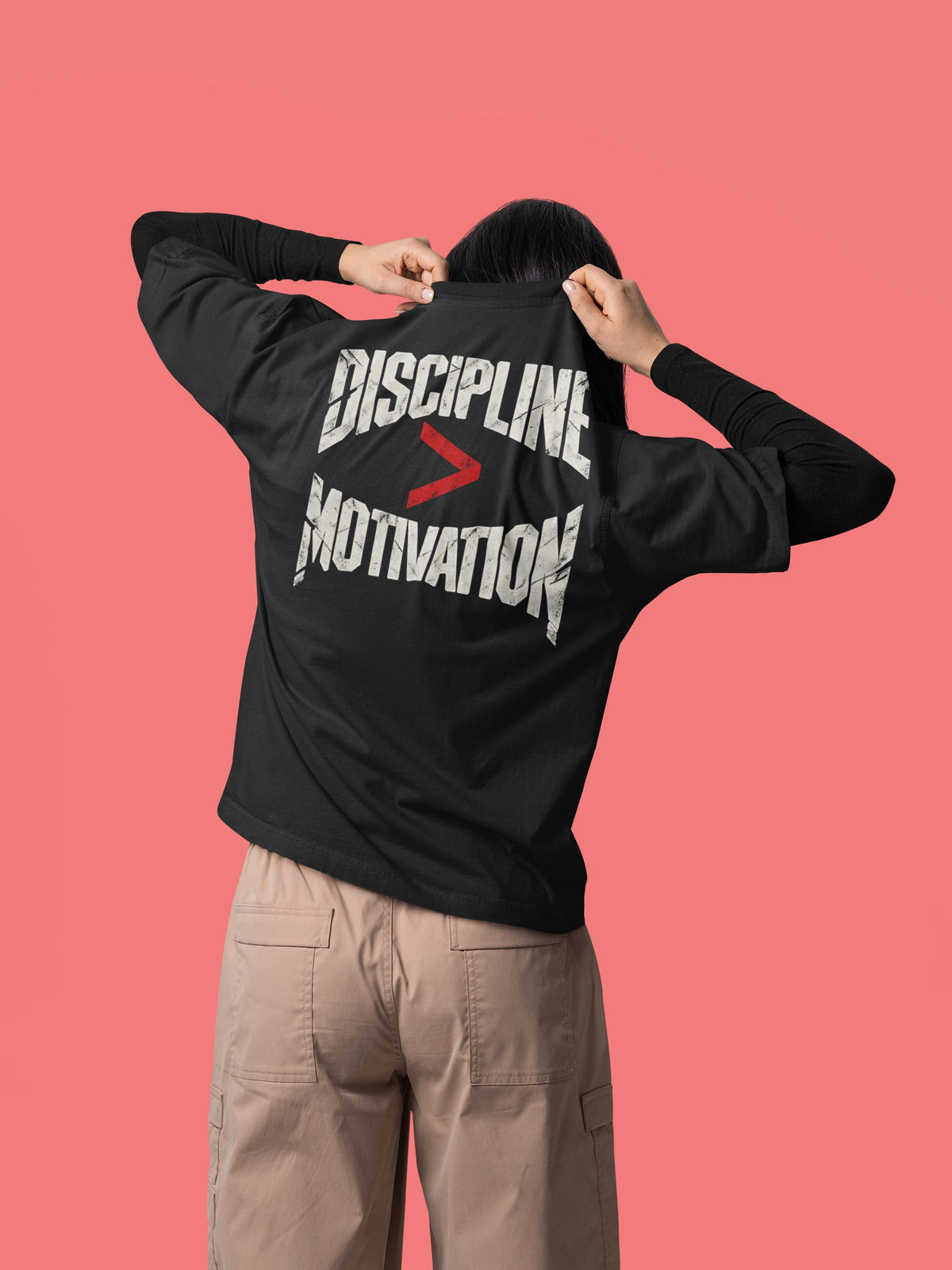 Black Discipline Over Motivation back print unisex oversized t-shirt worn by a woman, back view
