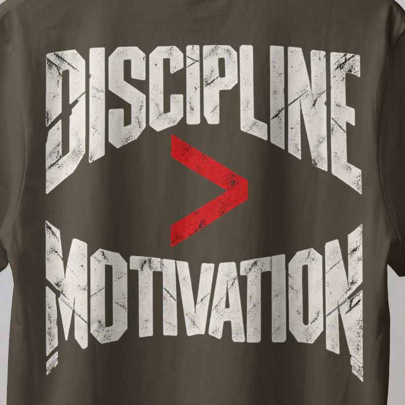 Olive Green Discipline Over Motivation back print close-up, cracked off-white letters with a red greater-than sign
