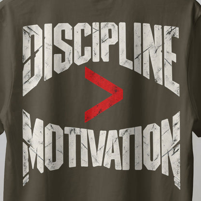 Olive Green Discipline Over Motivation back print close-up, cracked off-white letters with a red greater-than sign