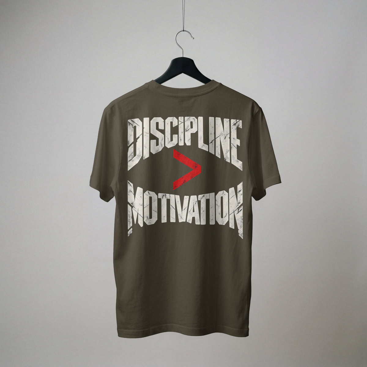 Olive Green Discipline Over Motivation oversized t-shirt on a hanger, showing the back print