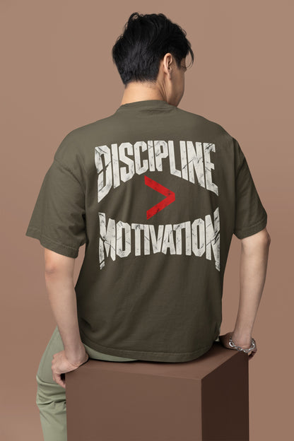 Olive Green Discipline Over Motivation back print unisex oversized t-shirt worn by a man, back view