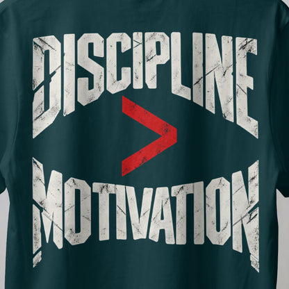 Petrol Blue Discipline Over Motivation back print close-up, cracked off-white letters with a red greater-than sign
