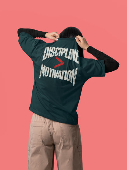 Petrol Blue Discipline Over Motivation back print unisex oversized t-shirt worn by a woman, back view