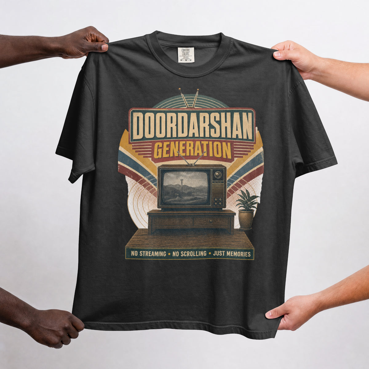 Black Doordarshan Generation oversized t-shirt held up flat to show the full retro TV print