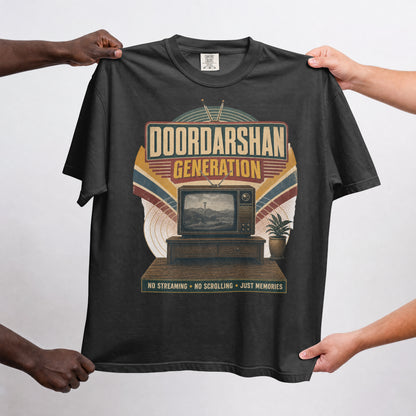 Black Doordarshan Generation oversized t-shirt held up flat to show the full retro TV print