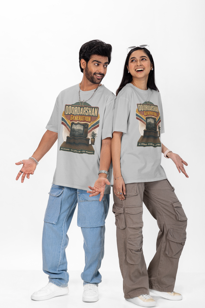 Man and woman wearing the Melange Grey Doordarshan Generation oversized t-shirt with baggy jeans on a plain backdrop