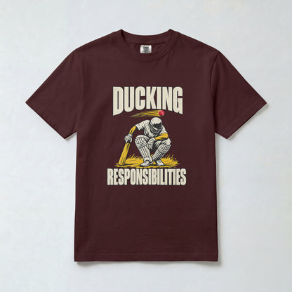 Maroon Ducking Responsibilities cricket t-shirt, front view with crouching batsman graphic