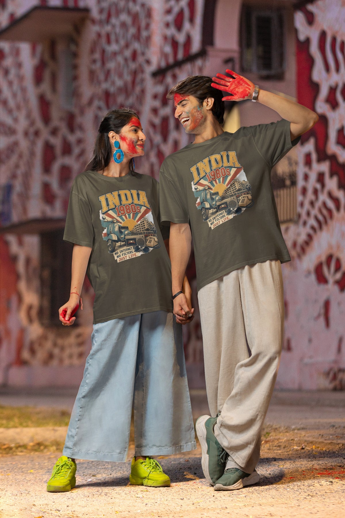 Couple styling the India 80s retro oversized t-shirt in Olive Green – INDIA 1980s front print