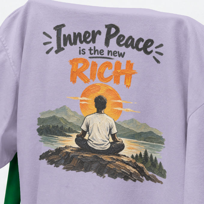 Lavender Inner Peace Is The New Rich print close-up, a figure meditating on a rock facing an orange sunset over mountains and a lake