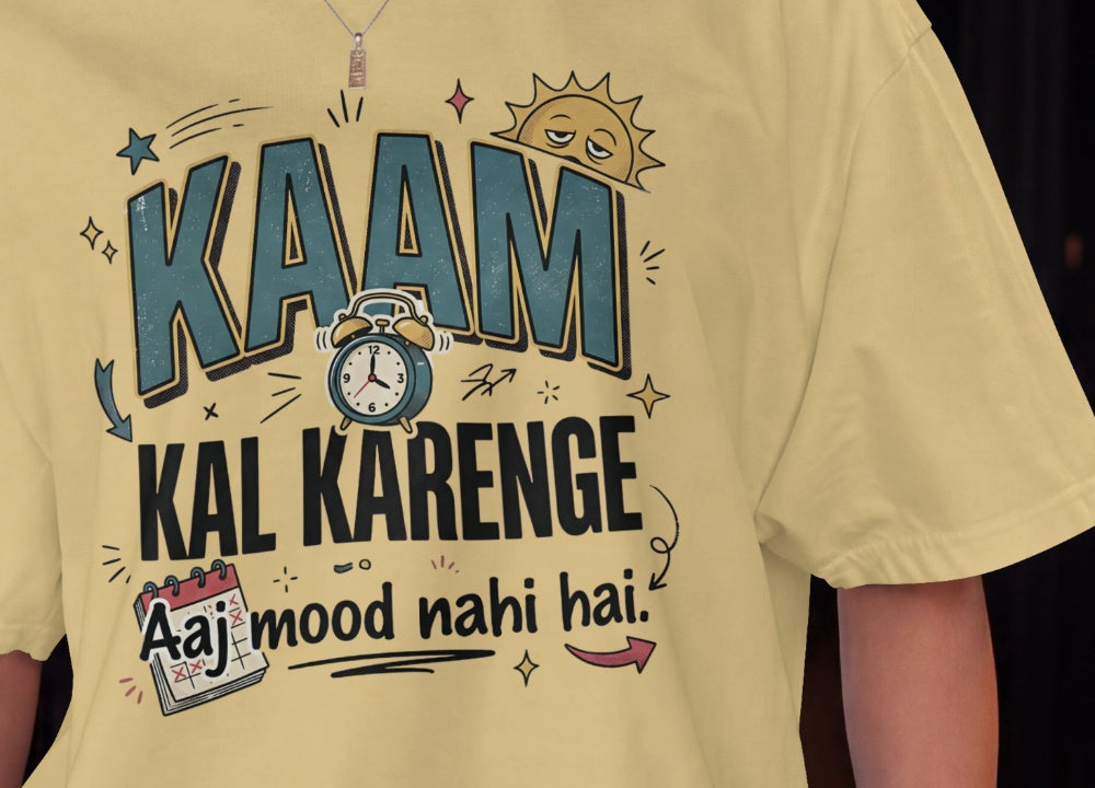 Beige Nauma oversized t-shirt design close-up of 'Kaam Kal Karenge' typography and doodle artwork.