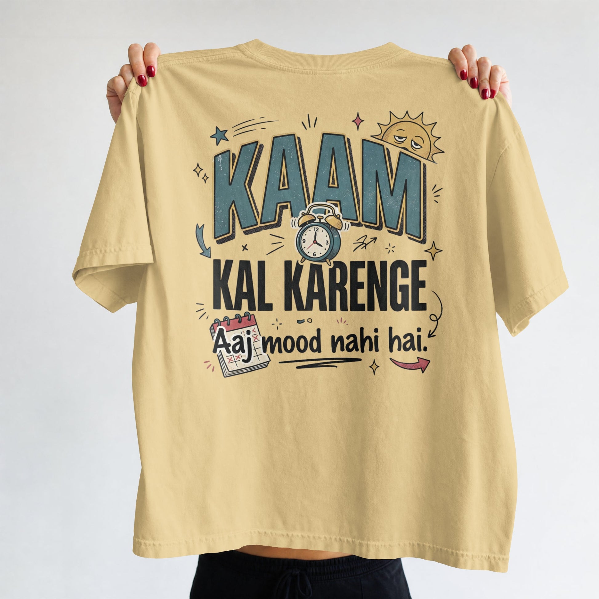Beige Nauma oversized t-shirt, front view, with bold 'Kaam Kal Karenge' typography and doodle-style graphic.
