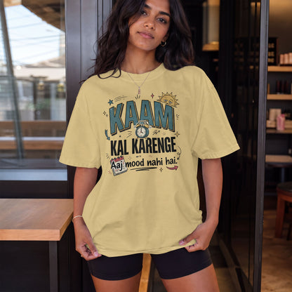 Beige Nauma oversized t-shirt, model shot, with 'Kaam Kal Karenge' typography and playful doodle artwork.