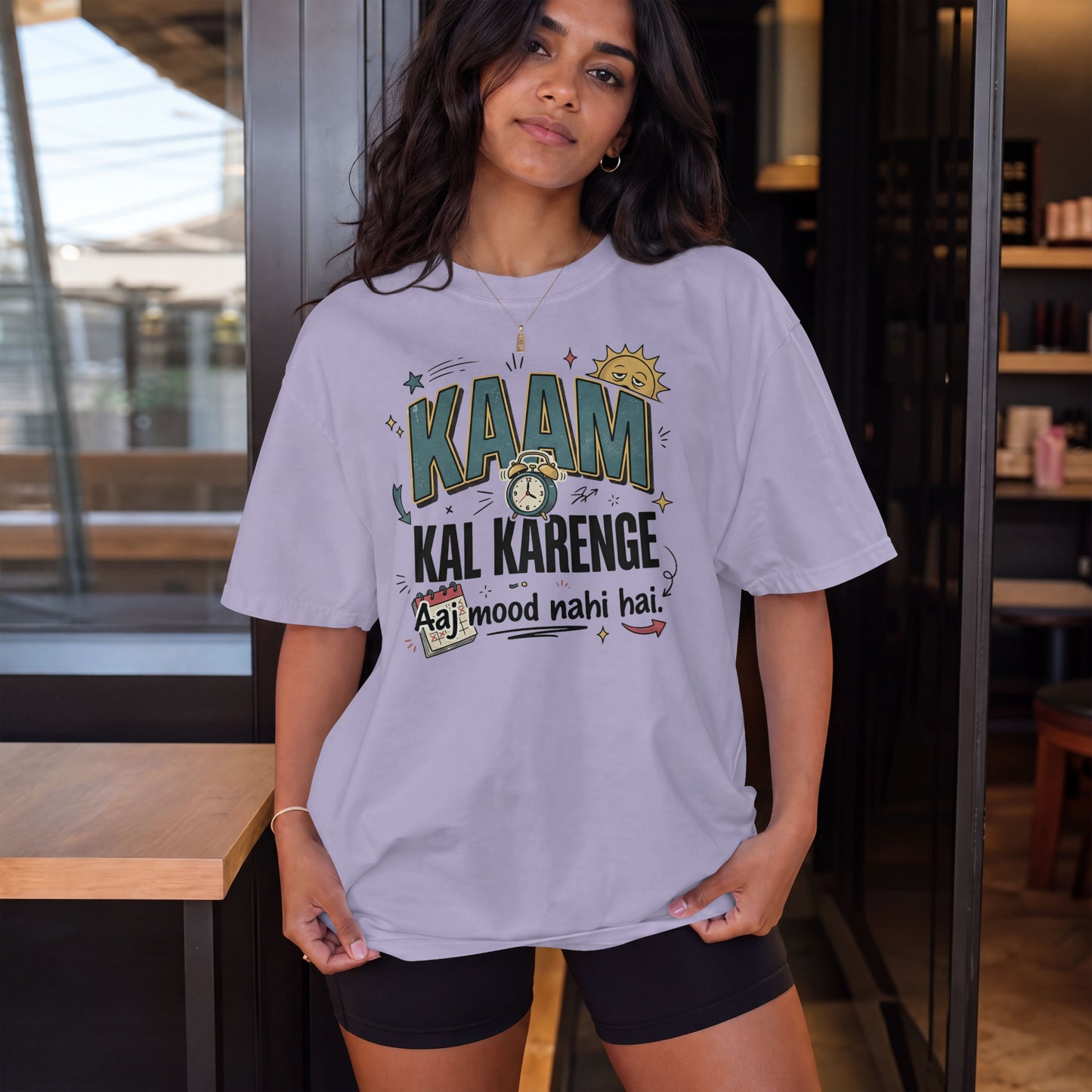 Lavender Nauma oversized t-shirt, model shot, featuring 'Kaam Kal Karenge' typography and doodle-style art.