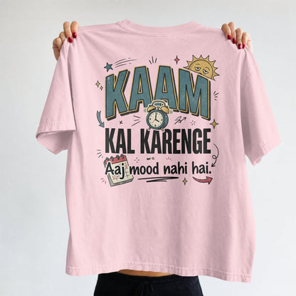 Light baby pink Nauma oversized t-shirt, front view, with 'Kaam Kal Karenge' typography and doodle graphic