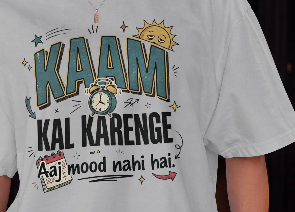 Melange grey Nauma oversized t-shirt design close-up of 'Kaam Kal Karenge' typography and doodle art.