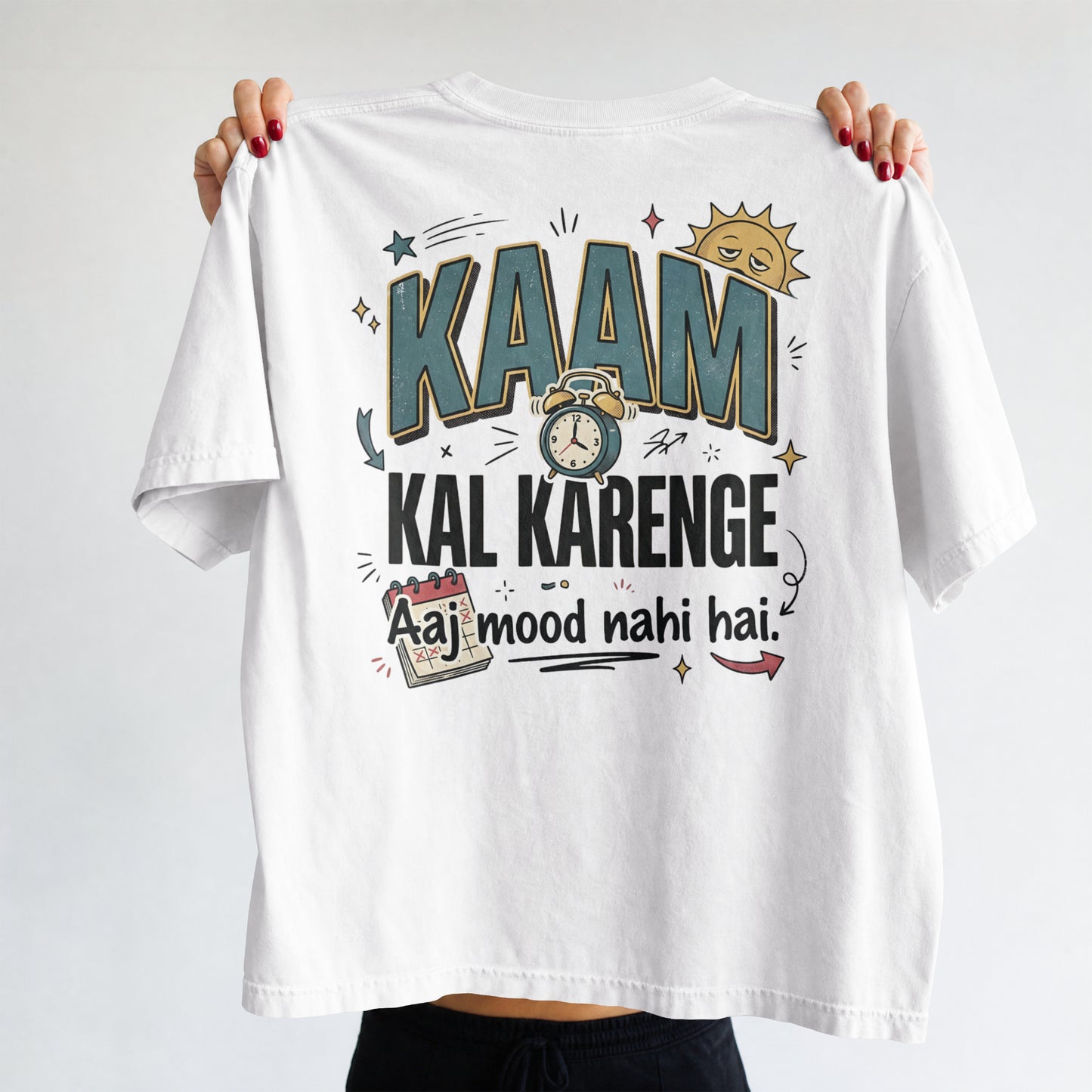 White Nauma oversized t-shirt, front view, with bold 'Kaam Kal Karenge' typography and doodle-style artwork.