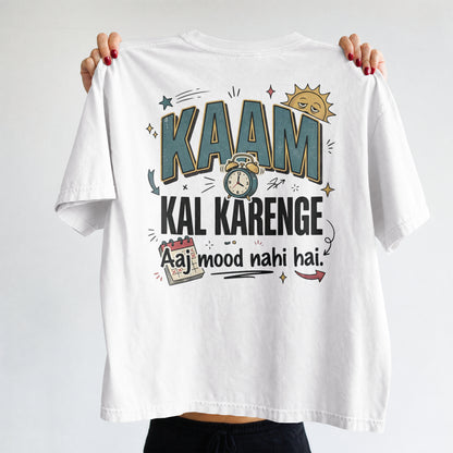 White Nauma oversized t-shirt, front view, with bold 'Kaam Kal Karenge' typography and doodle-style artwork.