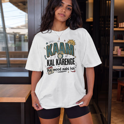 White Nauma oversized t-shirt, model shot, with bold 'Kaam Kal Karenge' typography and doodle-style artwork.