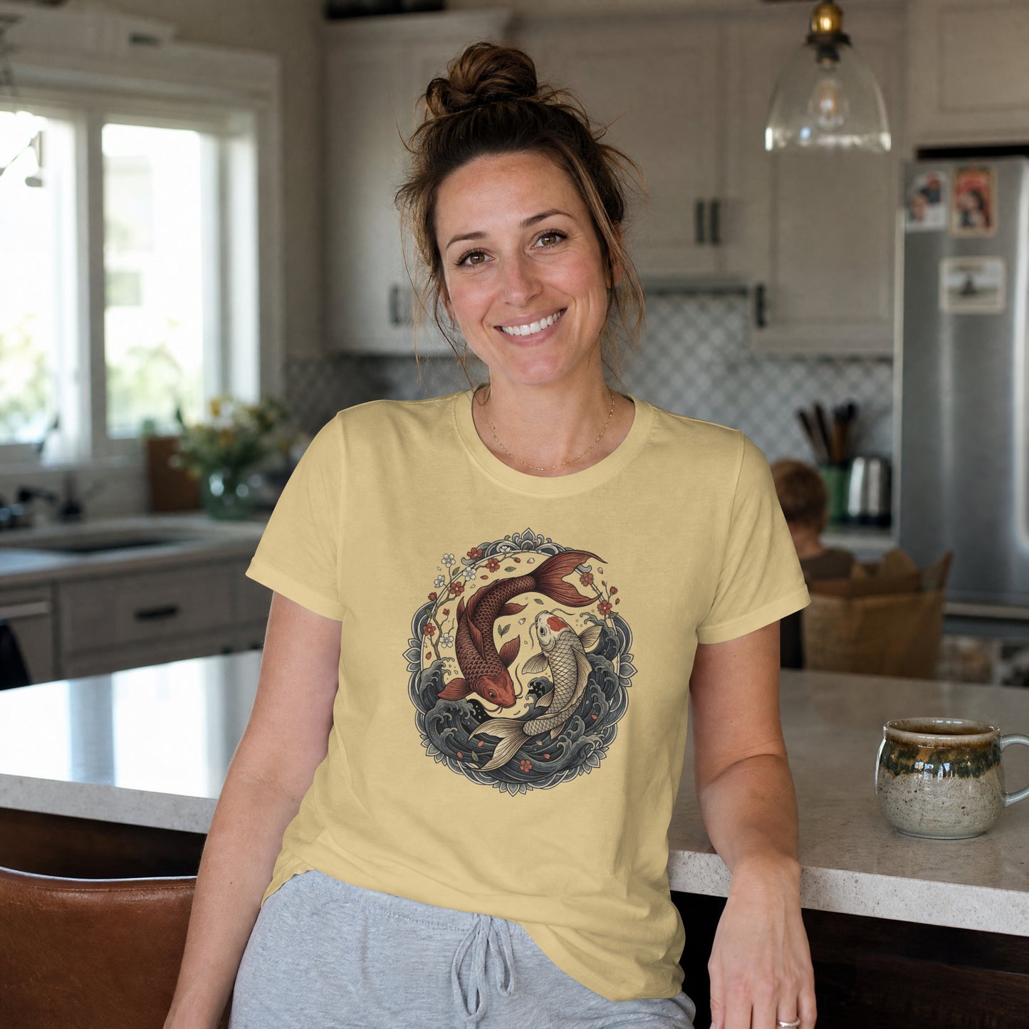 Woman wearing Nauma beige koi fish yin yang graphic cotton T-shirt, front view