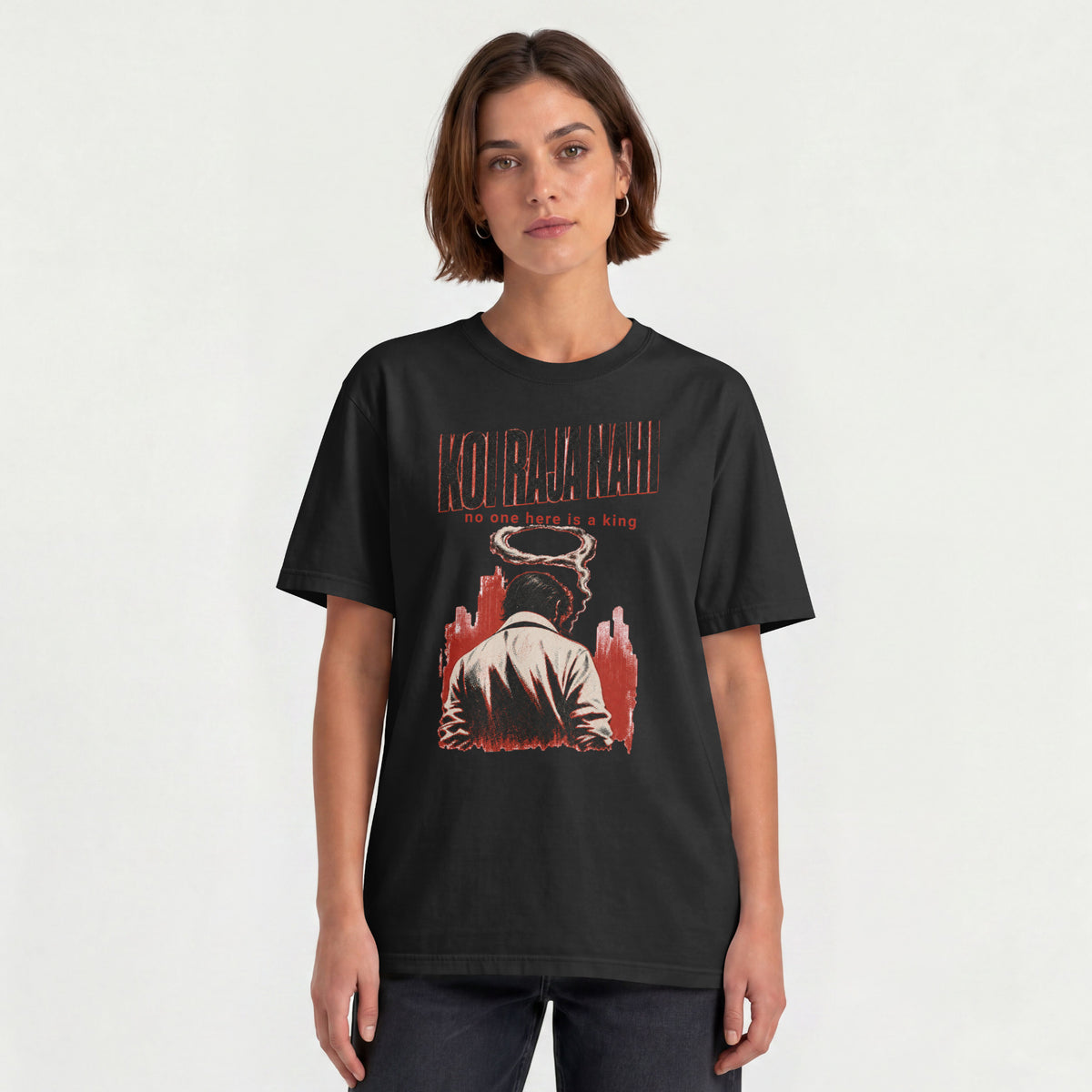 Woman wearing the black Koi Raja Nahi unisex oversized graphic tee