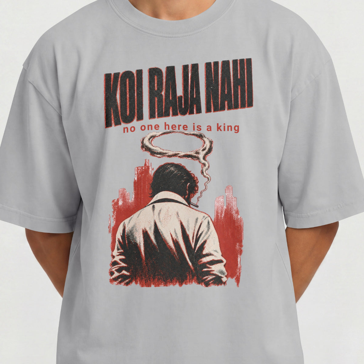 Close-up of the Koi Raja Nahi print on a melange grey oversized t-shirt, showing the distressed halftone lettering