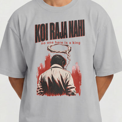 Close-up of the Koi Raja Nahi print on a melange grey oversized t-shirt, showing the distressed halftone lettering