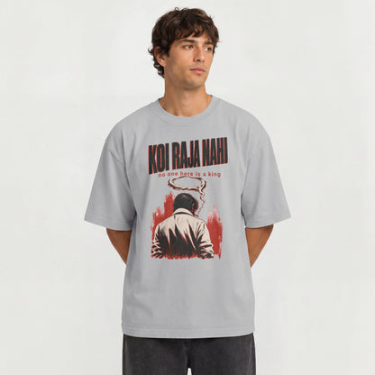 Man wearing the melange grey Koi Raja Nahi oversized graphic t-shirt
