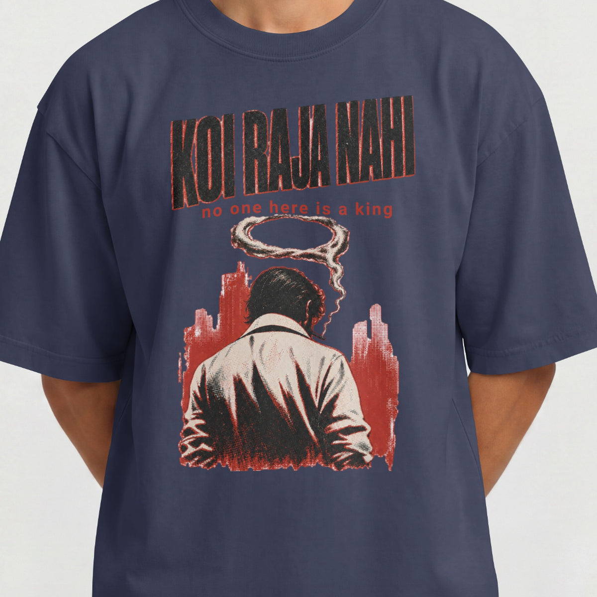 Close-up of the Koi Raja Nahi print on a navy blue oversized tee, showing the smoke halo and red skyline detail