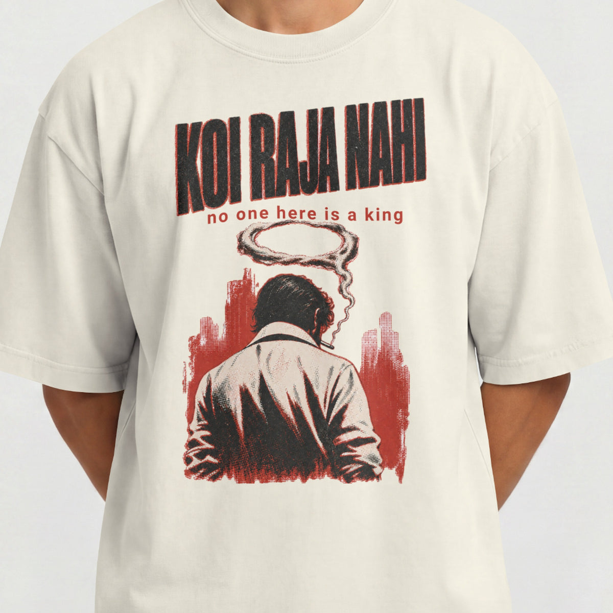 Close-up of the Koi Raja Nahi print on an off white oversized tee, showing the noir figure and halftone shading