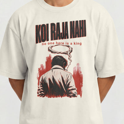 Close-up of the Koi Raja Nahi print on an off white oversized tee, showing the noir figure and halftone shading