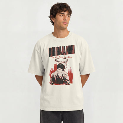 Man wearing the off white Koi Raja Nahi oversized t-shirt with black distressed typography