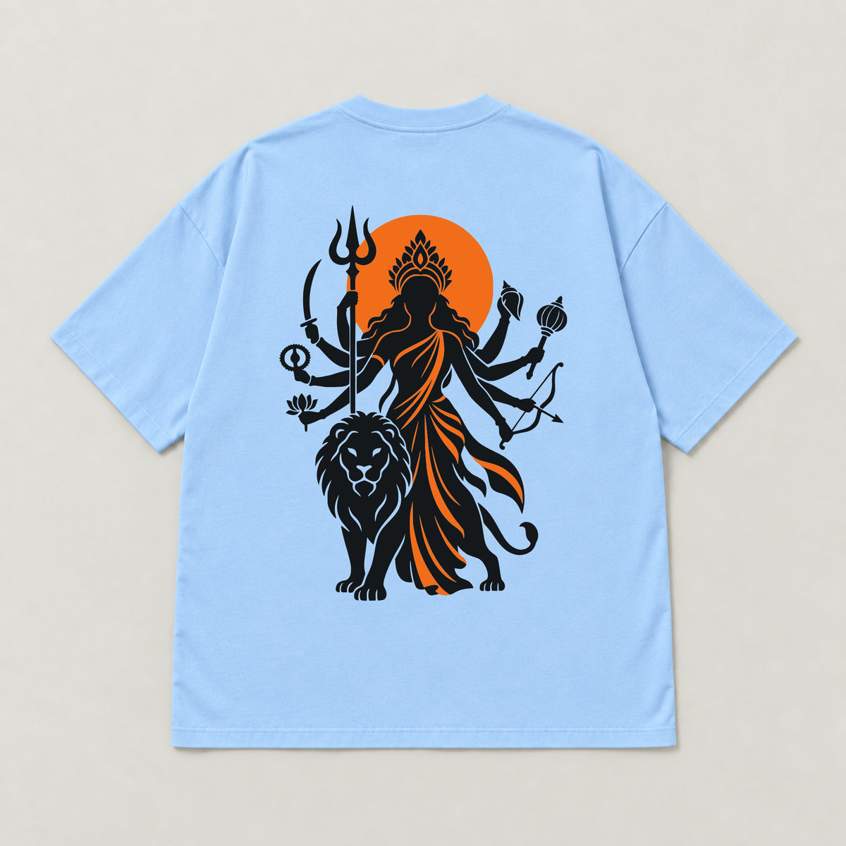 Baby Blue Maa Durga Saffron Sun oversized t-shirt laid flat, showing the Durga and lion back print