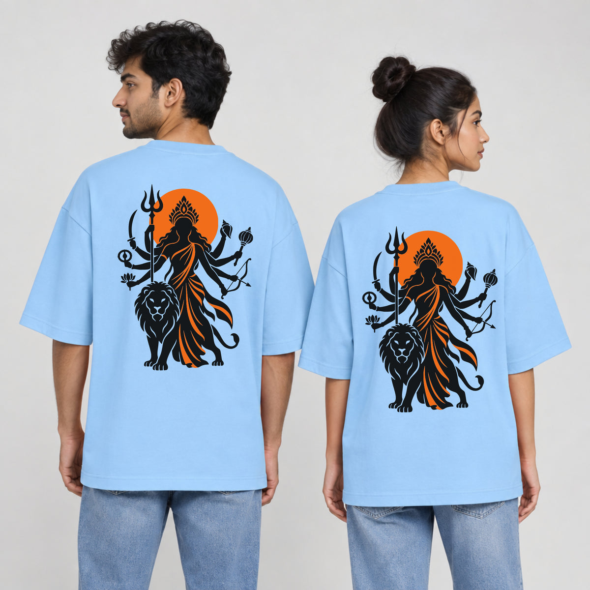 Baby Blue Maa Durga Saffron Sun back print unisex oversized t-shirt worn by a man and a woman, back view