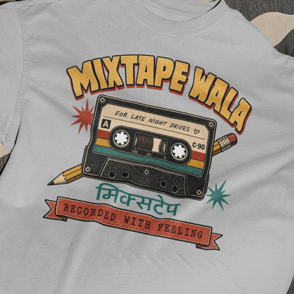 Melange Grey Mixtape Wala oversized t-shirt, close-up of the retro cassette print with Hindi मिक्सटेप text and Recorded With Feeling banner