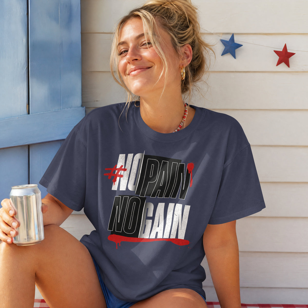 Woman in the navy blue No Pain No Gain oversized T-shirt, bold condensed gym typography across the chest