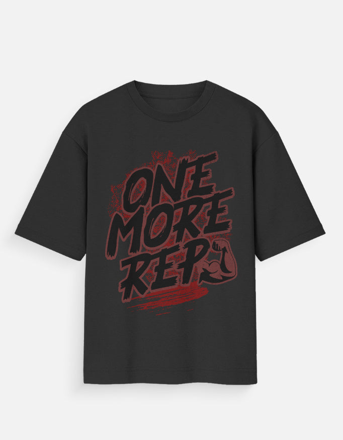 Nauma One More Rep gym graphic unisex oversized T-shirt in black, front view with the slogan print reading in deep red on black