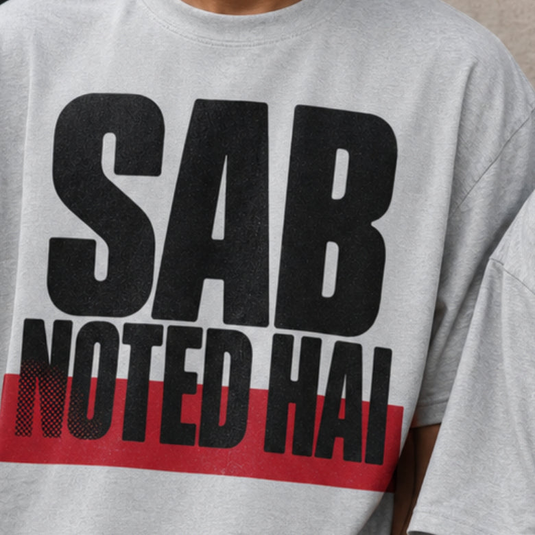 Sab Noted Hai print close-up on melange grey oversized t-shirt