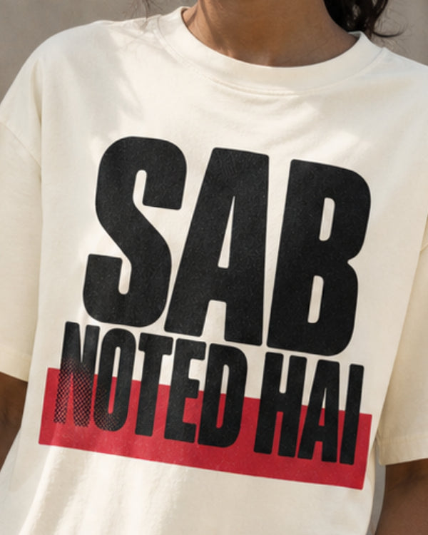 Sab Noted Hai print close-up on off white oversized t-shirt