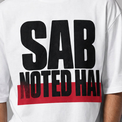 Sab Noted Hai print close-up on white oversized t-shirt