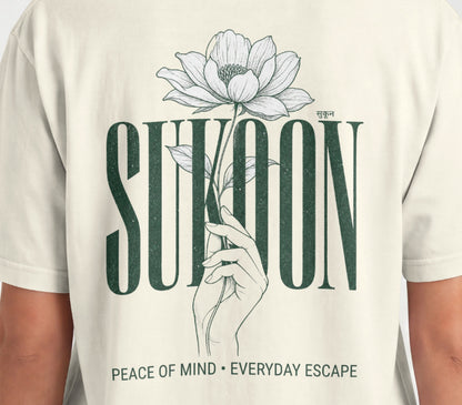 Closeup of Nauma Sukoon oversized t-shirt back print in off white with lotus flower and hand illustration